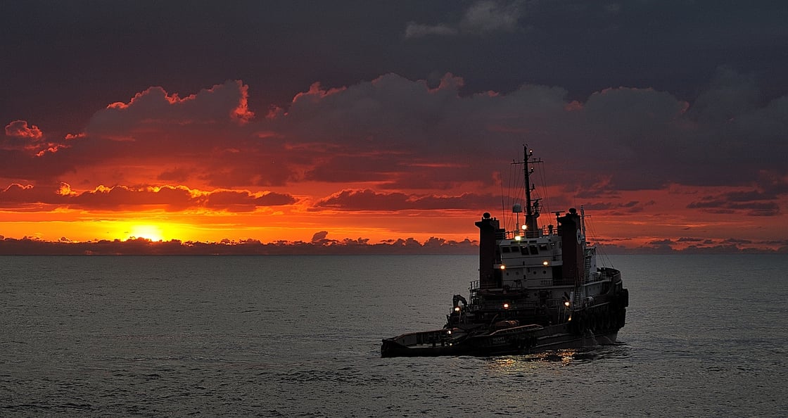 Husky anchor handling at sunrise